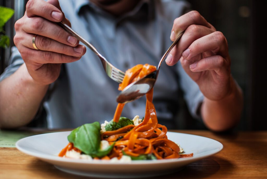 closeup shot of a male reeling up the pasta with a 2023 11 27 05 31 49 utc min