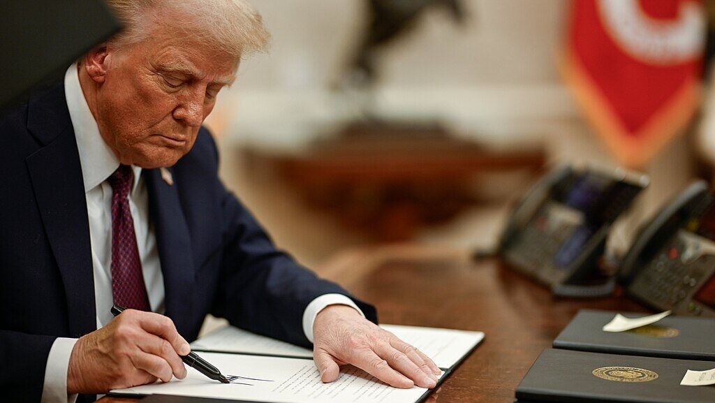 1024px President Donald Trump signing executive orders 04 e1748523822342