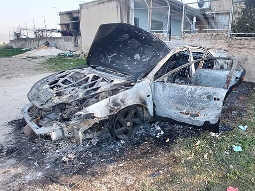 512px Burnt Car in Huwara